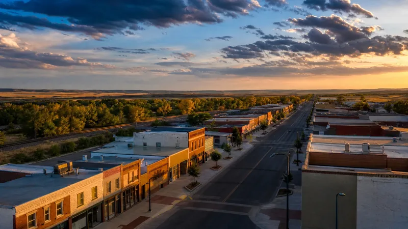 Small plains city main street of low brick buildings beside a wide flat river valley with cottonwoods, Kearney NE Business License